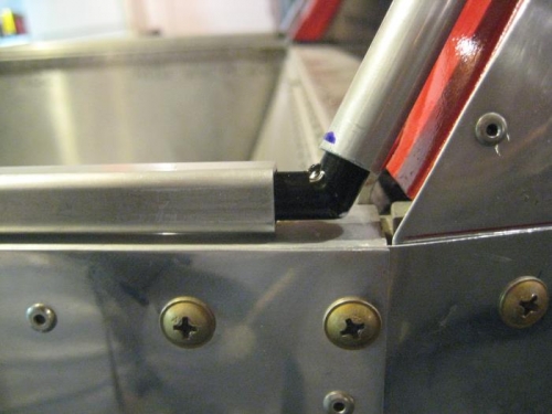 Rear bow meets horizontal square tube, joined with corner bracket.