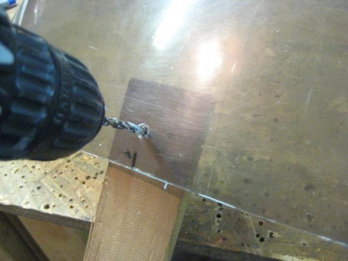 Dulled drill bits through canopy into wood backup