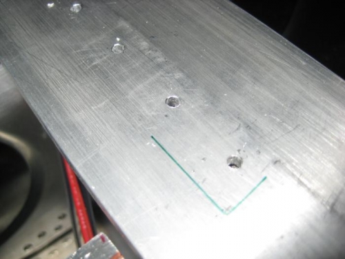 Holes in the spar cap, waiting for  deburring.