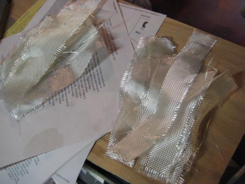 Strips of fiberglass mat cut and ready to install.