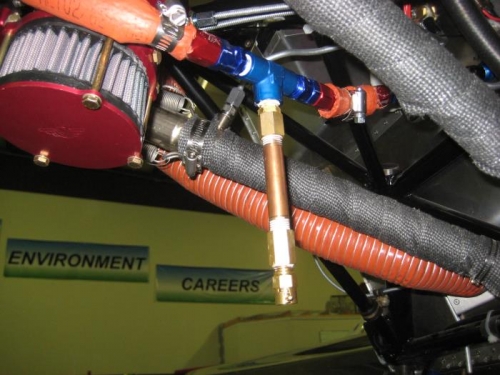 Drain extension. It will go through a hole in the lower cowl.