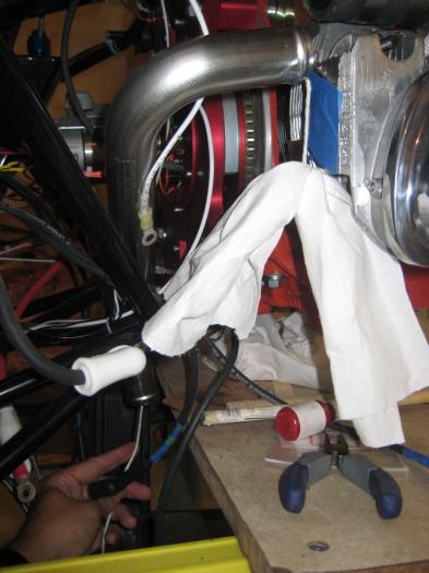 Shop rag on a string, to pull through intake pipes.