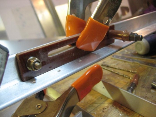 One end with the nut; one with the cleco.