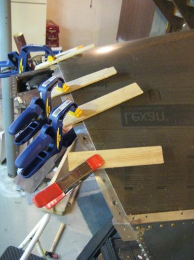 AFTER trimming, the clamped-in-place forward edge.