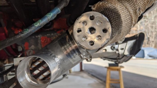 Restrictor moved to the upper end of the muff.