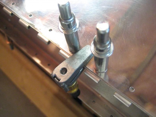 Cleco clamps also help hold the hinge while pilot drilling.