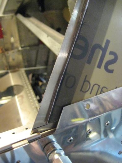 New bow strap, cut flush with top of fuselage stringer.