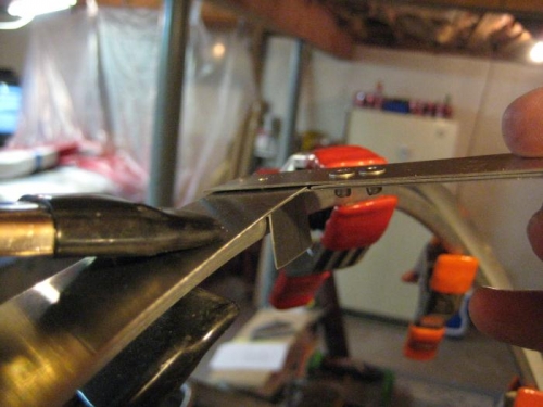 The tool in use, to drill the first hole at top dead center.