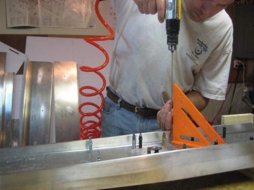 Long bit to avoid marring the spar cap. Used a triangle to keep it vertical to the spar web face.