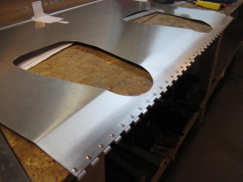 Hinge at front of seat