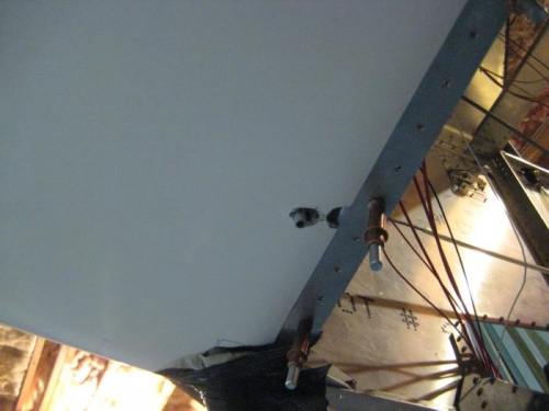 Underside of cowl with old and new fuel overflow outlet