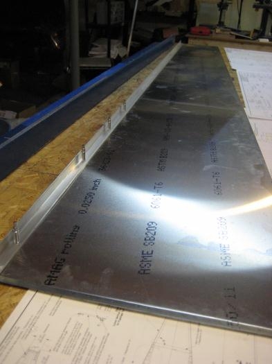 1st longeron (upper) being drilled and cleco'd