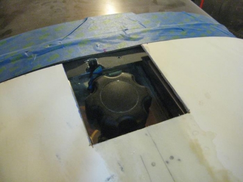 In place over the fuel filler.