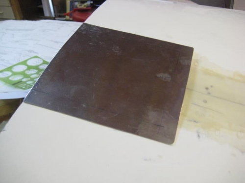 0.025 aluminum fuel door, over the cutout.