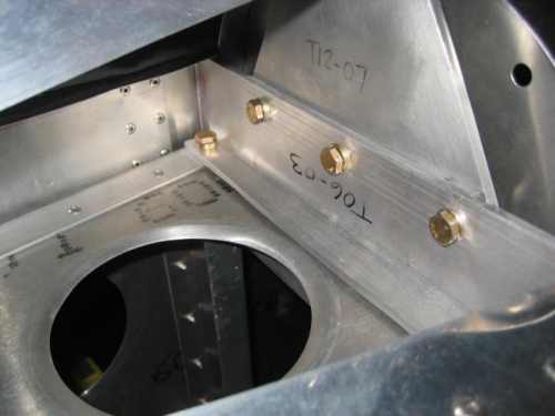 Forward section of tail secured with 3 bolts into the 3 anchor nuts