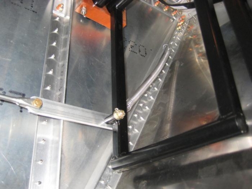 Rudder cable and return spring fully installed.