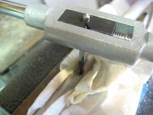 Tapping the first hole in the bow (in vice, with paper towel cusion)