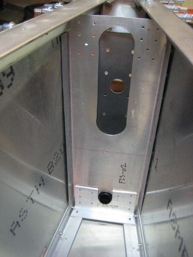 Bulkhead F23-02 sandwiched between two parts.