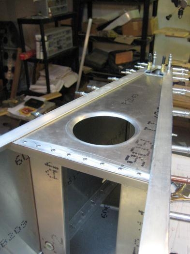 Shear web F22-03 clamped in place. Angle F22-06 is out of view underneath.