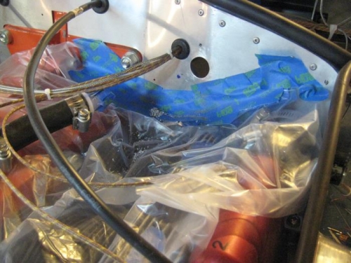 Plastic to keep metal shavings out of engine compartment.