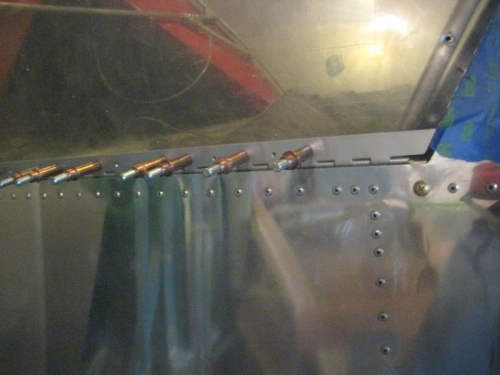 Passenger-side hinge strap cleco'd to frame.