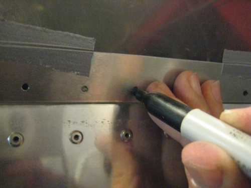 Press strap and canopy against the frame and mark hole locations.