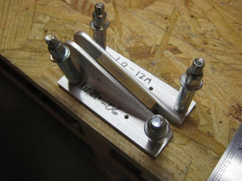 Held down and together with clecos set into workbench top