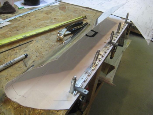 Drilling through the hinges into the fairing.