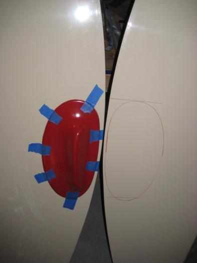 The wingtip light pod, with the outline on the other wing tip.