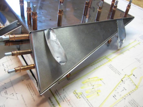 Tape to pull the tip rib into place.