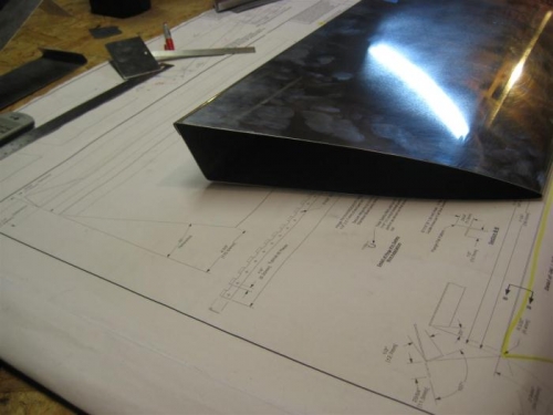 I cut just outside the lines on the metal, with snips, then finished with files & sandpaper