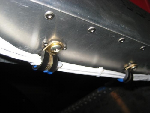 The clamps are secured with machine screws into 2-lug anchor nuts.