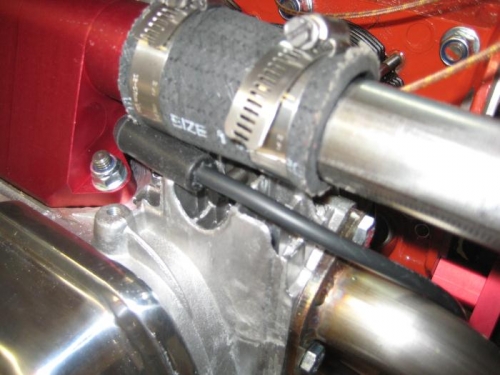 Upper left spark plug. Sonex LLC says to support the plug wire from the intake pipe.