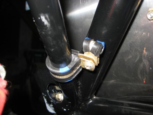 2 Adel clamps on one of the engine mount tubes. The small clamp will take the control cable.