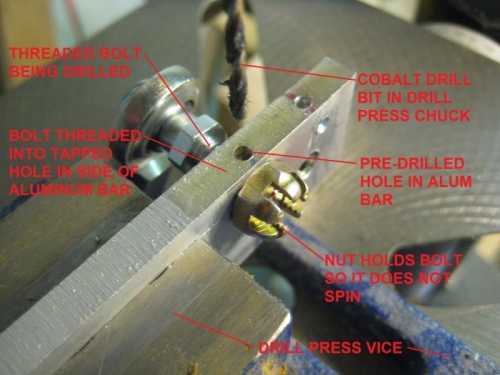 Drill guide in vice, clamped to drill press table.