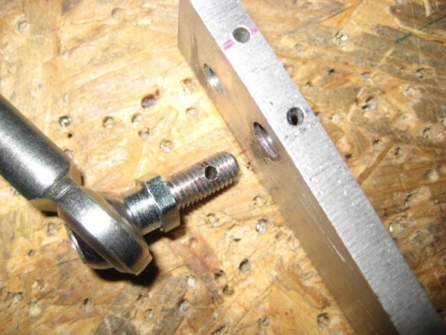 The resulting hole after backing out the bolt.