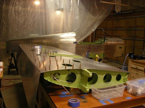Lower aft skin riveted in place