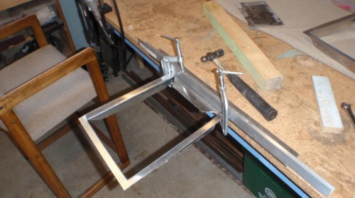 frame is bent ovet the edge of the work table