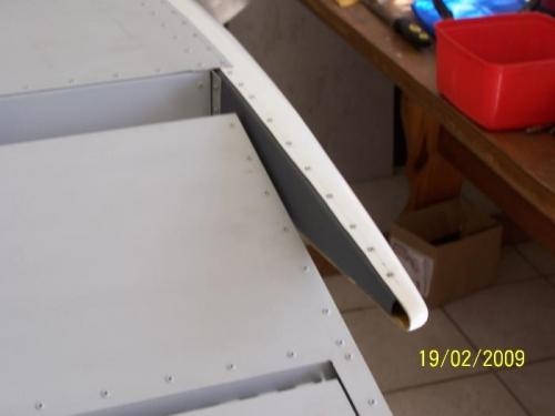 Left side, underneath.