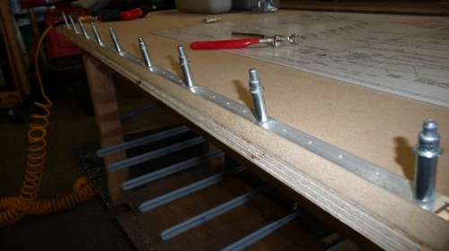 By drilling and clecoing the wedge to the edge of the table, the countersinking is fairly easy.