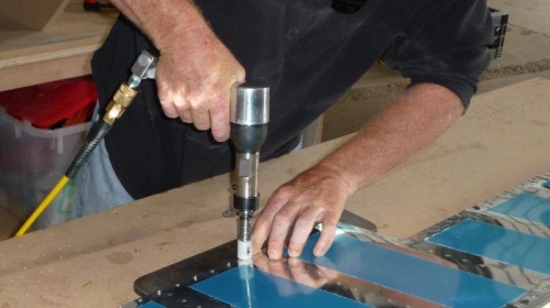 Using back-rivet technique to half-set the trailing edge, prior to finishing off with flush set in gun