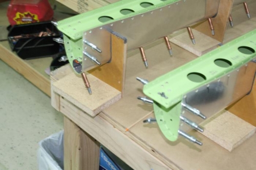 Spars to ribs riveted and ends not riveted.