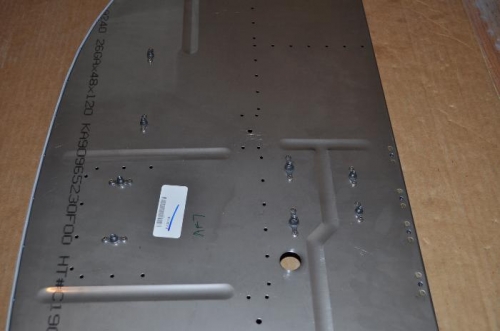 Nutplates riveted to Firewall