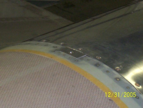 Plate to cover cowl pins