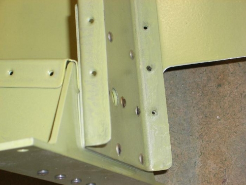 That reinforcing plate is on the wrong side of the spar.  See taht skin and flange holes don't line up