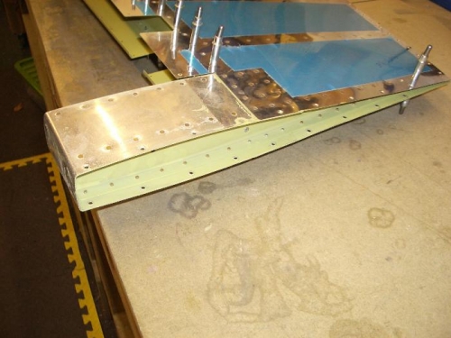 Upper rudder rib riveted in place