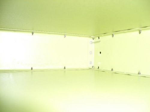 Two pop rivets set - one in place with shank visible