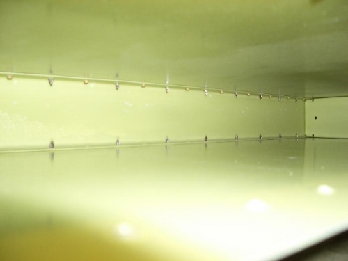 Alternatng clecos and set rivets.