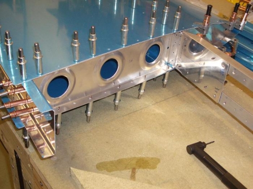 Rib to skin holes now drilled; preparing to drill rib to spar holes