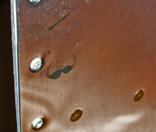 close up of back of rivet in dimple